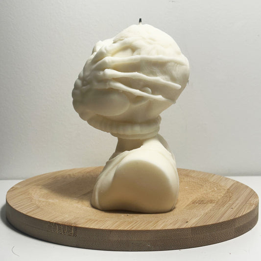Side profile of sci-fi Facehugger sculptural candle for home decor