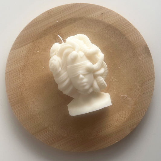 Mythology-inspired Medusa candle styled on a shelf for aesthetic home decor