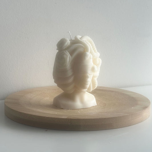Close-up of intricate serpentine detail on handcrafted Medusa wax bust